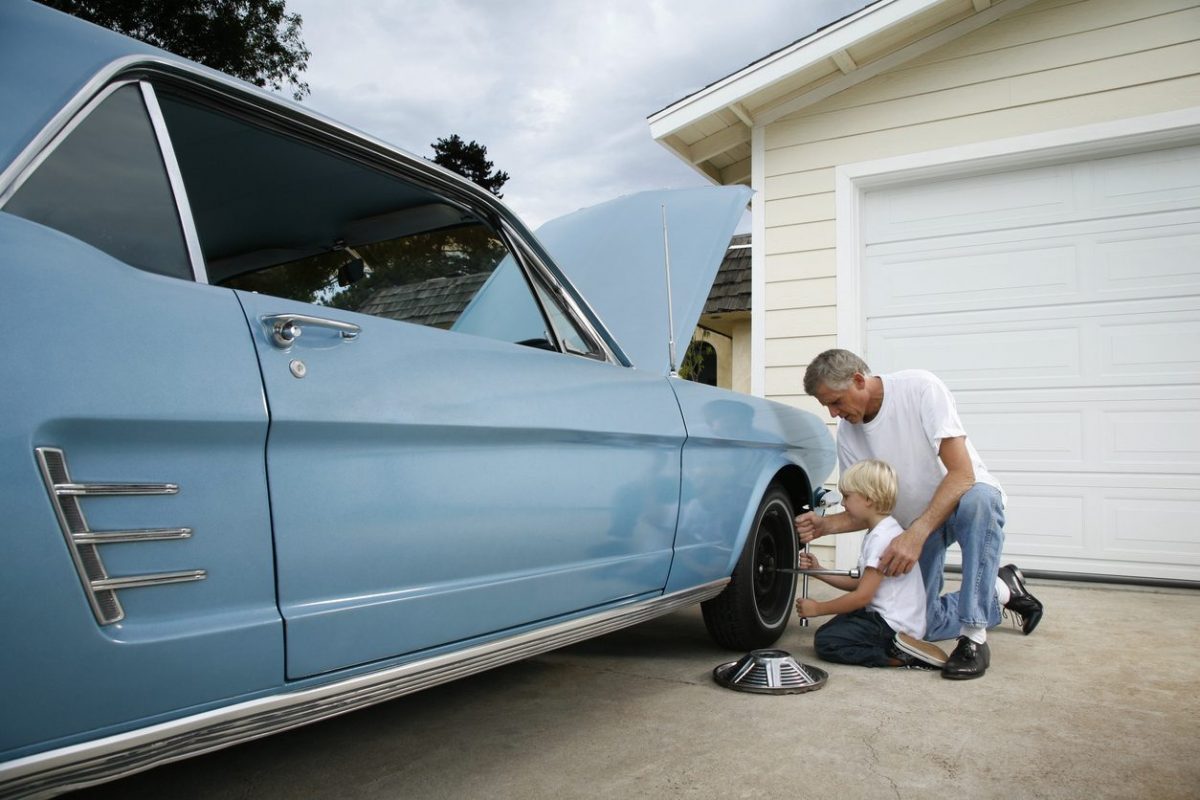 father and son repairing european car in dallas